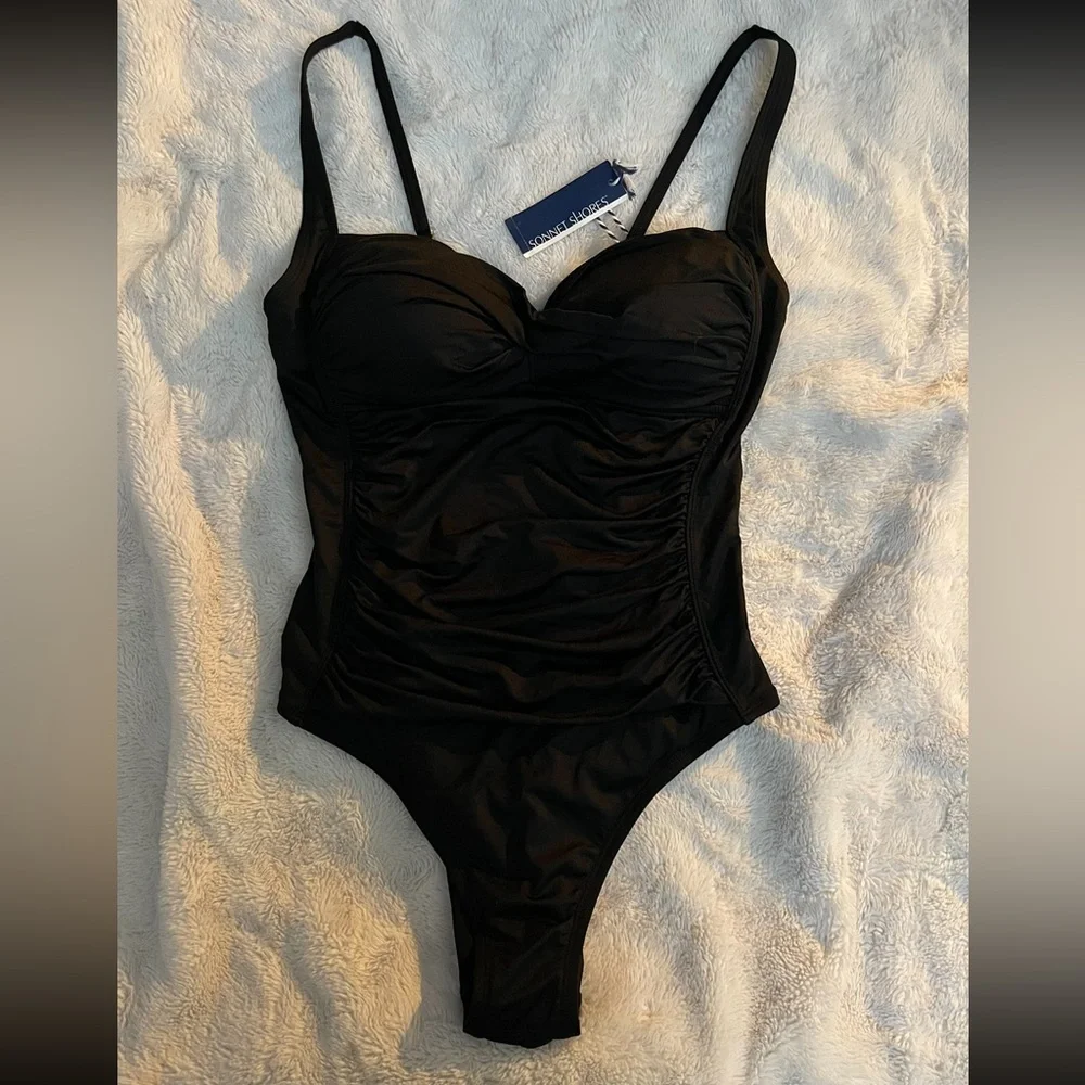One piece black swim suite body shaping 😉 tag still on originally 78$ - Picture 1 of 2